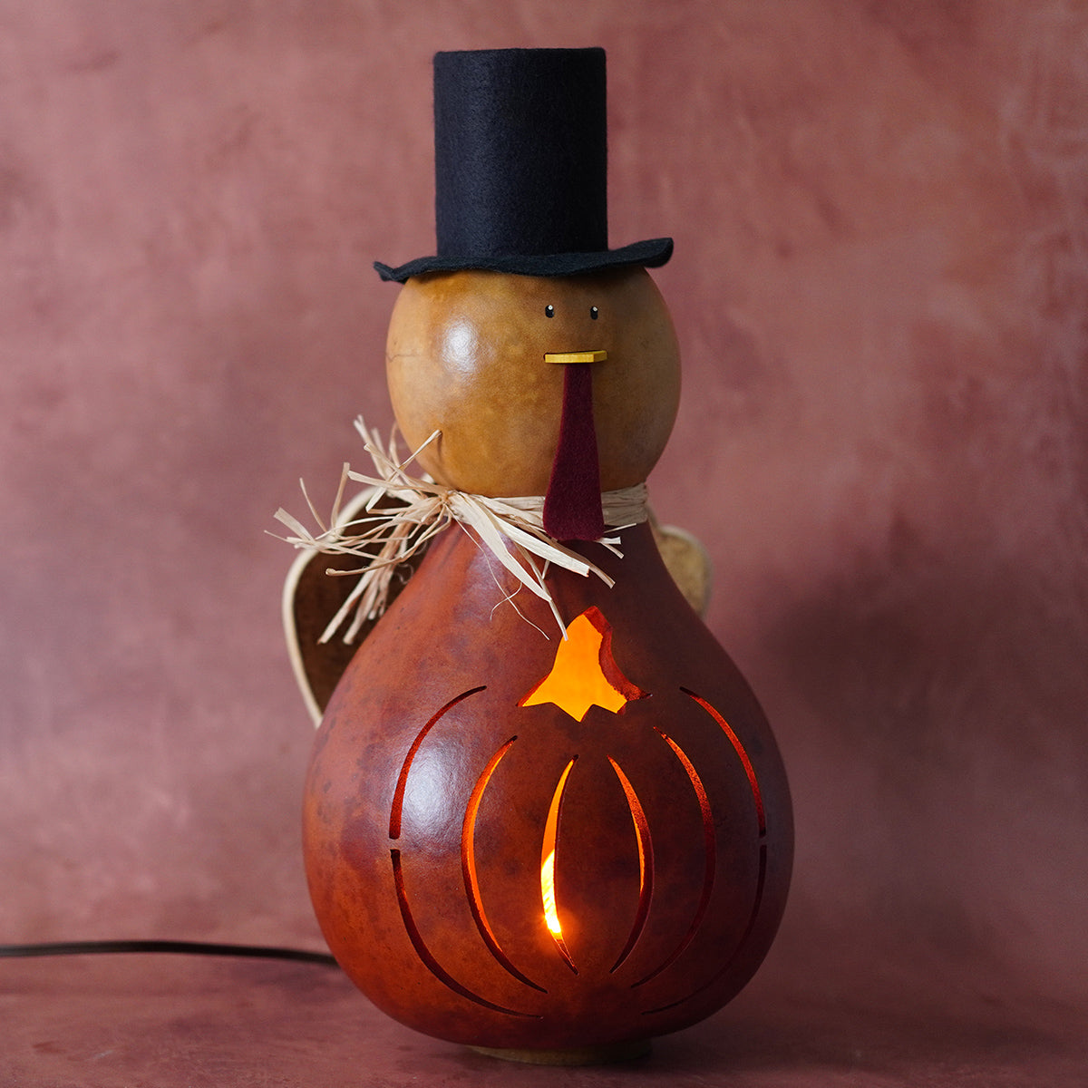 Theodore large lighted turkey gourd in amber with black top hat and maroon tie by meadowbrooke gourds natural gourd
