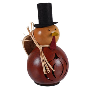 Theodore miniature gourd turkey gourd with glossy amber body, black felt hat, red wattle, and carved pumpkin design by meadowbrooke gourds