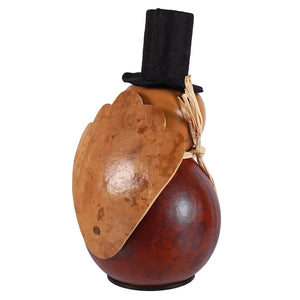 Theodore miniature gourd by meadowbrooke gourds is a rustic two-toned turkey gourd with a black top hat and tan leaf