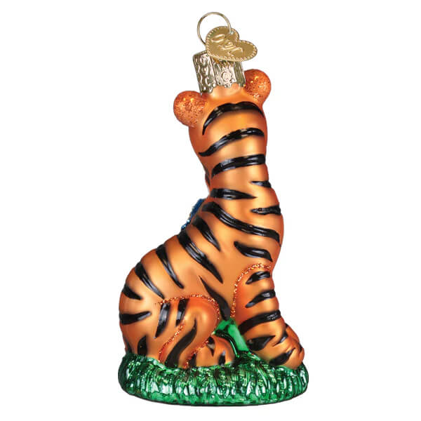 Orange tiger ornament with black stripes sitting on green base perfect as a tigger ornament or whinnie the pooh ornament