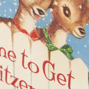 A vintage block sign featuring two deer with glittery red and green bows on a snowy blue background for merry christmas vintage decor