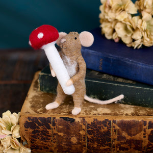 A charming brown felt switch mouse critter holding a red-capped toadstool mouse critter ornament perfect for witch switch decor