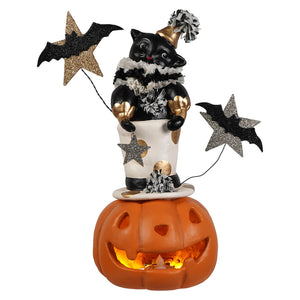 Top hat jack with cat figurine features a black cat with gold accents and pom-pom hat on glowing jack o lantern base