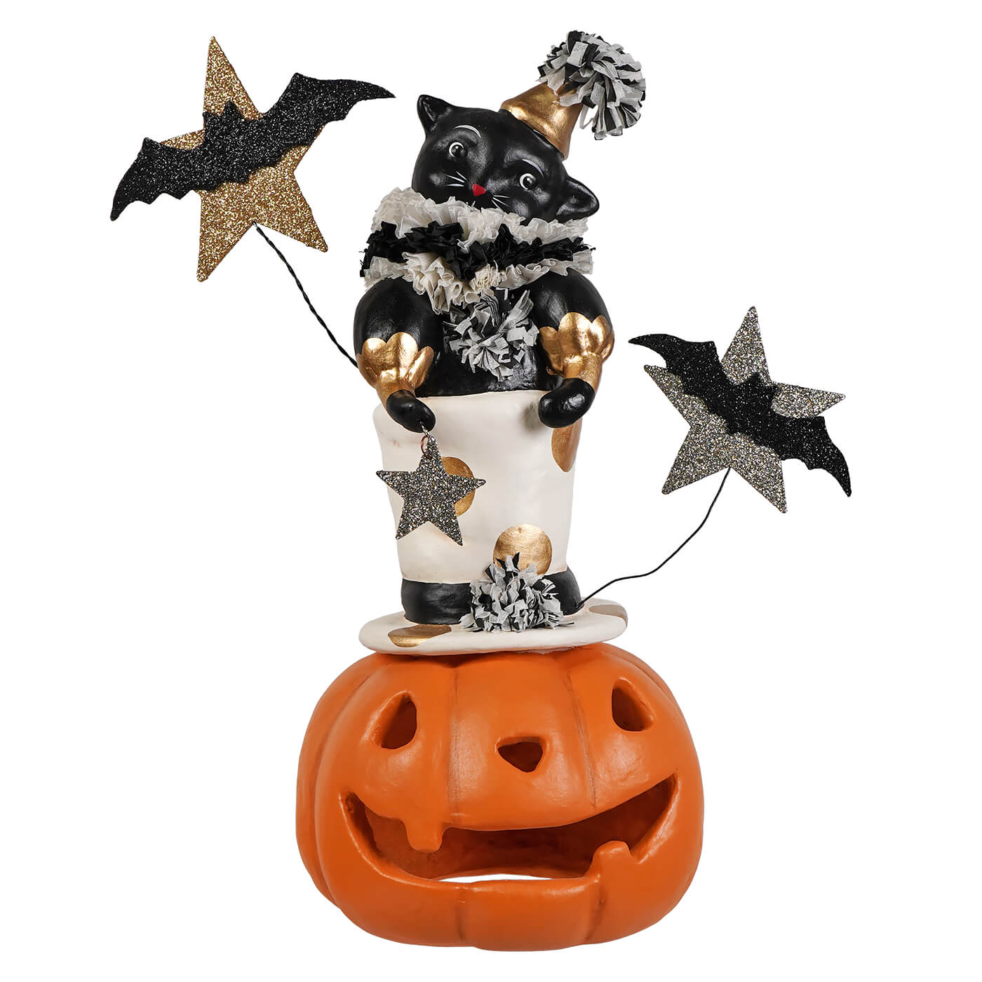 Black cat figurine with gold accents wearing a pom-pom hat and ruffled collar holding glittery jack o lantern decorations