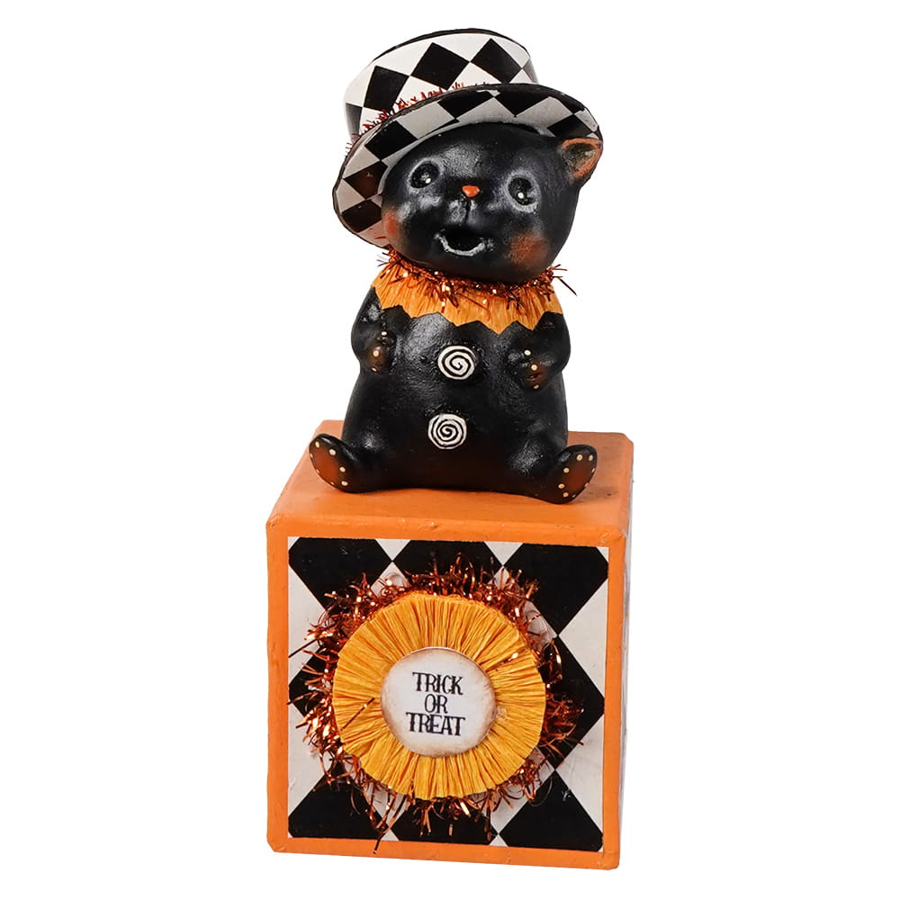 Black cat kitty boo figurine with checkered top hat and orange tinsel collar on orange block with trick or treat sign
