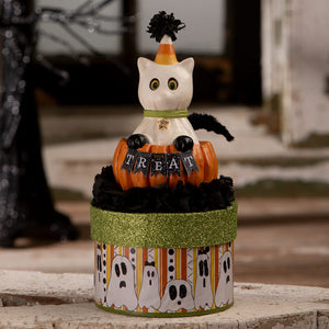White ceramic cat figurine named treat casper wearing a candy corn hat sits on a pumpkin in a halloween cats box