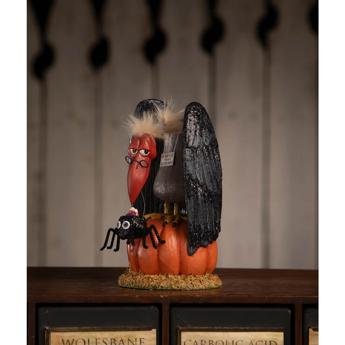 Halloween vulture figurine with black spider on orange pumpkin perfect for treats for the buzzard decor