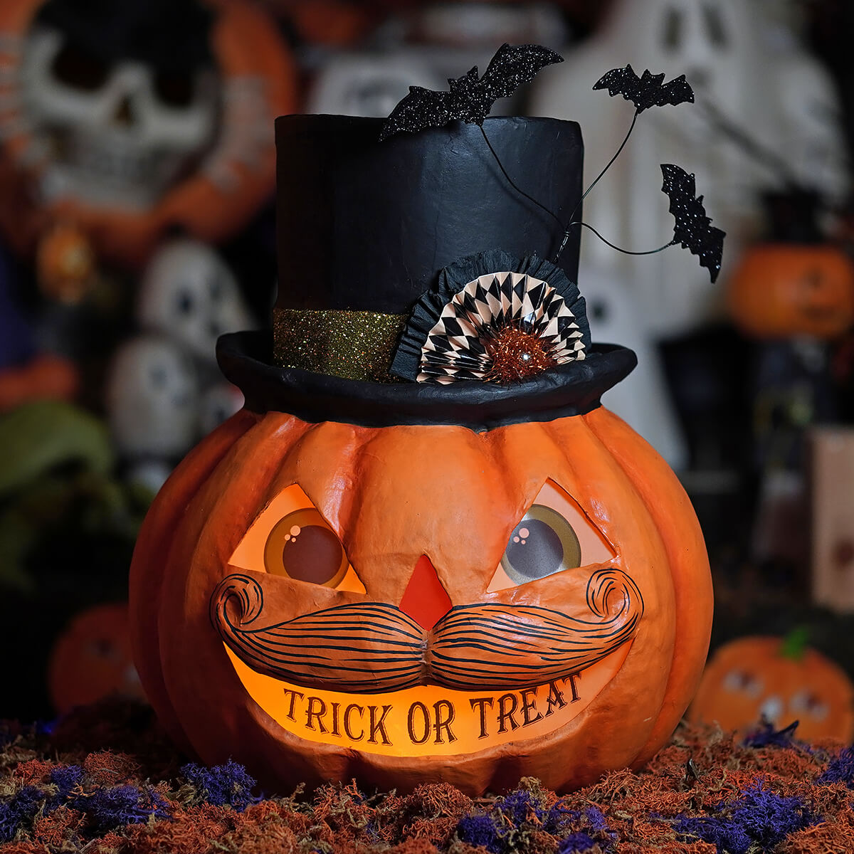 Orange treat pumpkin stache lantern with black top hat glittery bats carved eyes mustache and trick or treat light