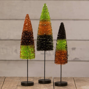 Three festive glittery halloween bottle brush trees in candy corn colors with black stripes delights bottle brush trees set