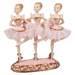 Pink resin triple ballerina table piece featuring three ballerinas with gold accents and delicate mesh skirts