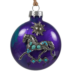 Purple glass ornament features a silver turquoise mustang and sun motif perfect for a bette day decoration