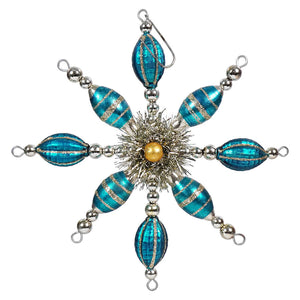 Ornate snowflake-shaped Christmas ornament with turquoise and silver beads.