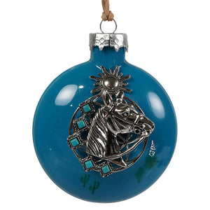 Vibrant blue glass turquoise trail stallion ornament features silver horse head with turquoise accents and sun motif