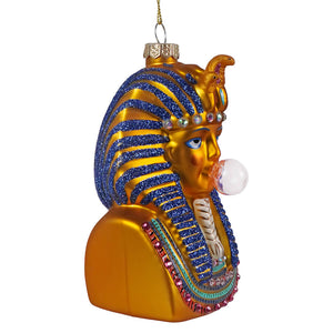 Golden glass tutankhamun glass ornament with blue glitter stripes and gemstone accents blowing a clear bubble by cody foster