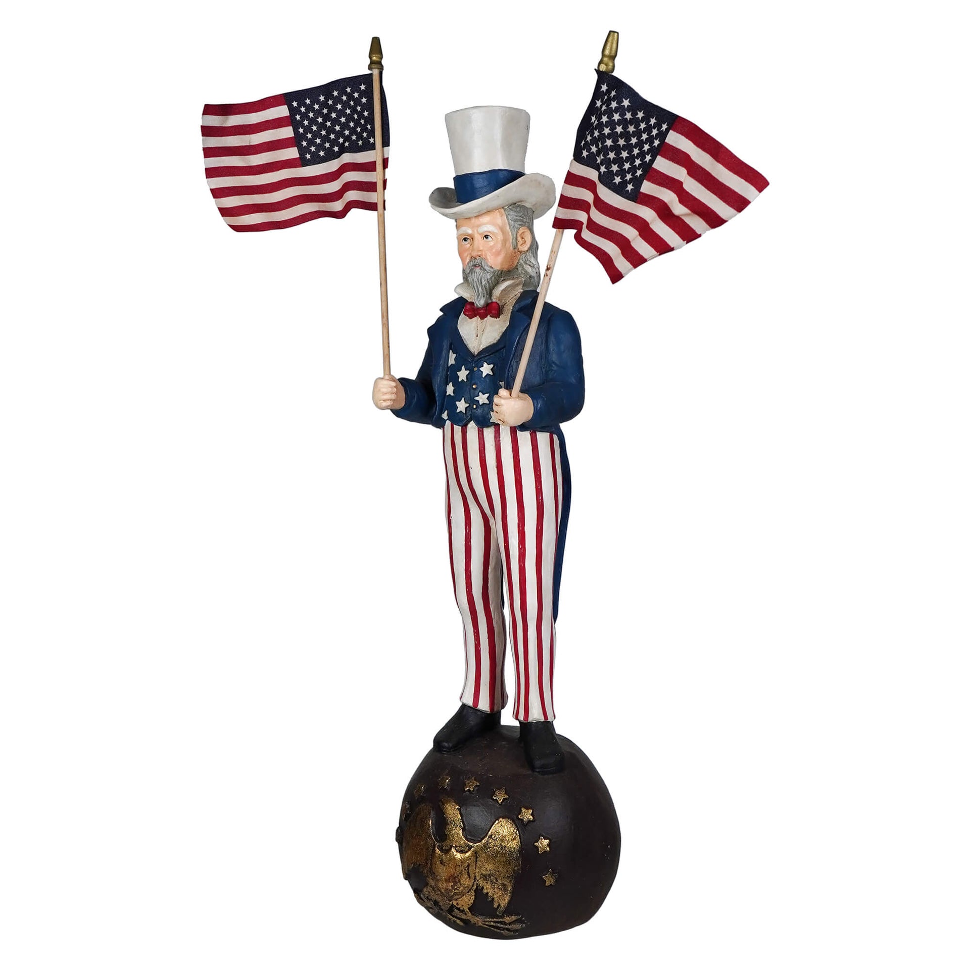 A painted wooden bethany lowe design uncle sam stands holding two american flags atop an eagle globe ball