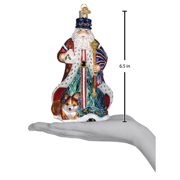 Festive christmas glass ornament of a workshop santa ornament in red and blue robe holding golden staff with corgi dog