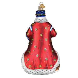 Red Christmas glass ornament featuring a United Kingdom Santa ornament with gold crown motifs and white fur trim
