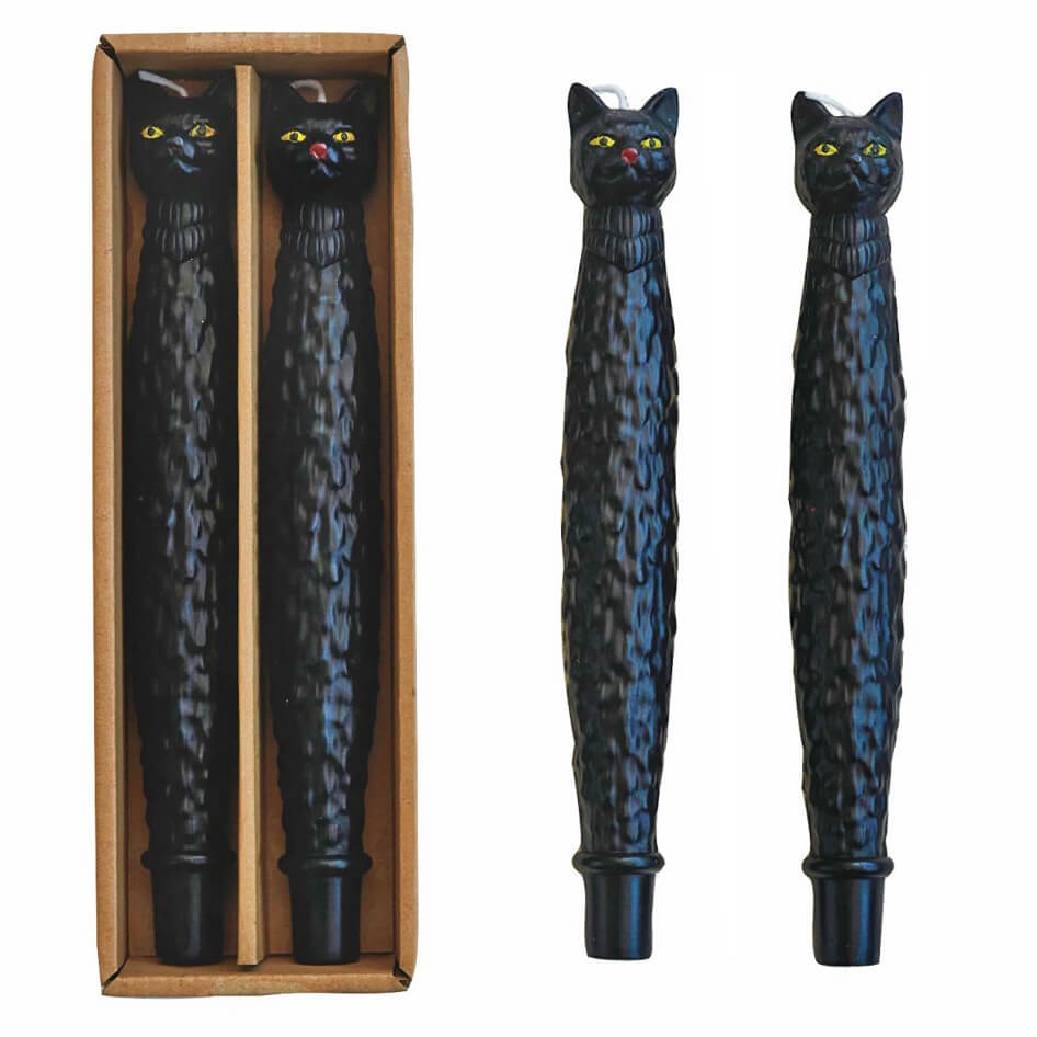 Black cat-shaped pens with colorful eyes.