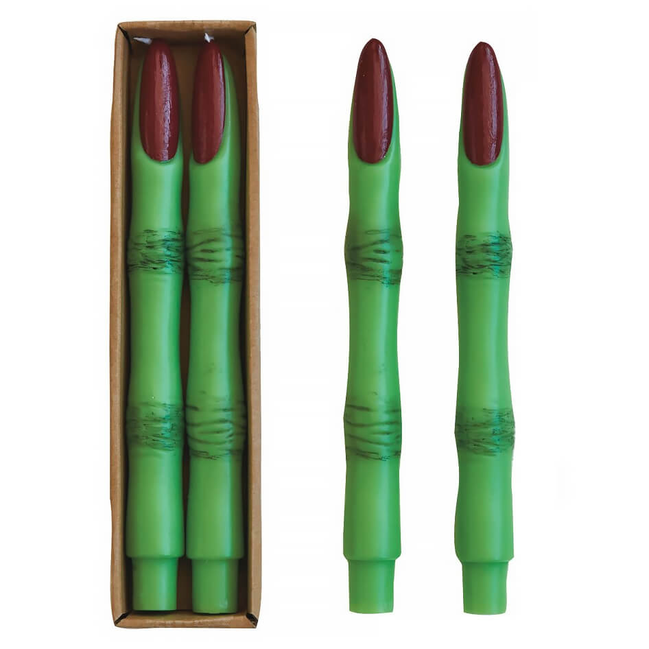 Green candles shaped like witch fingers with burgundy-colored fingernails.