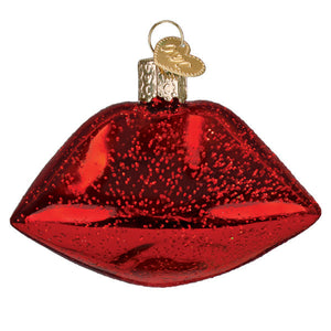 Shiny red glittery glass vampire lips ornament with gold heart tag perfect for figural decor and lighted decor