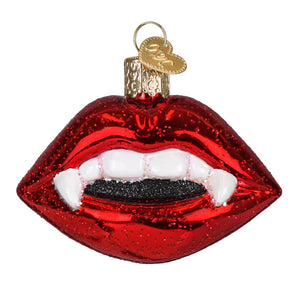Red glittery glass vampire lips ornament with white teeth black sparkly tongue and gold heart tag figural decor