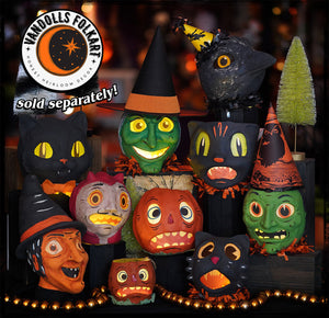 A vintage halloween black cat lantern with a dapper bow tie and glowing eyes in green orange and red colors