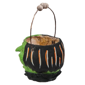 Vandolls folk art halloween lantern bucket shaped like a green faced witch cauldron with orange white stripes and wooden handle