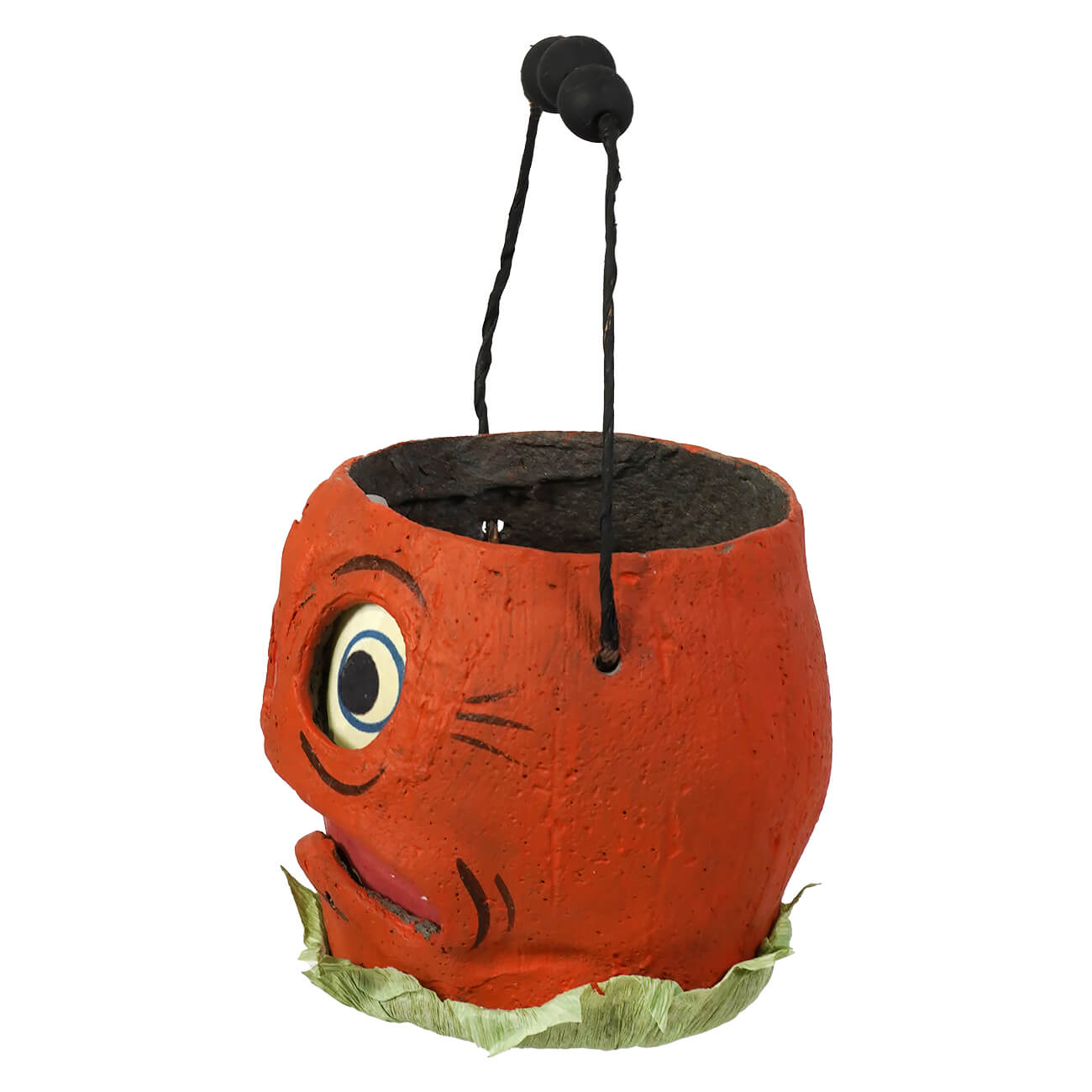 Orange pumpkin shaped halloween bucket with painted face black handle and green leafy base by vandolls folk art rachel garrison
