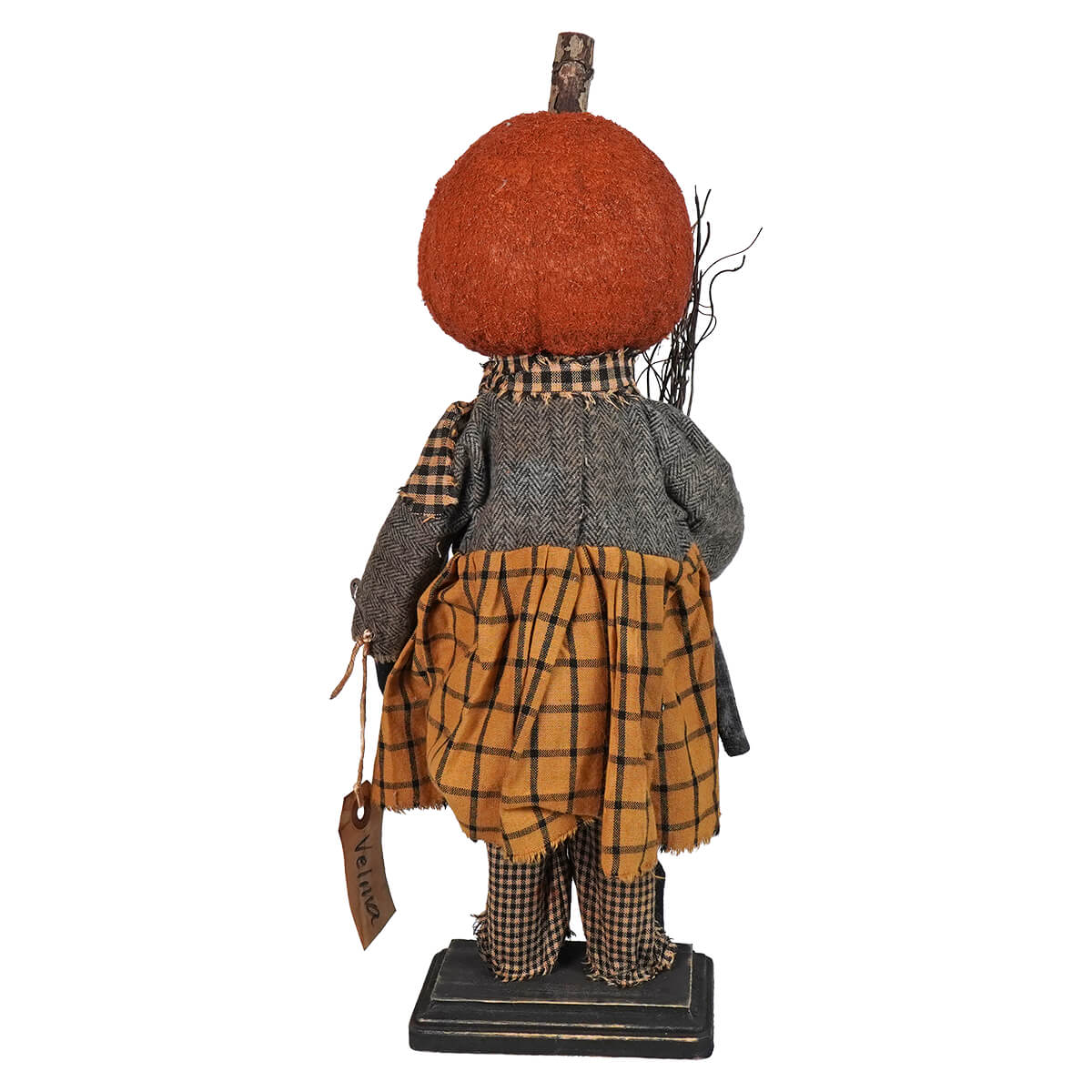 Decorative autumn-themed figurine with a pumpkin head and rustic clothing.