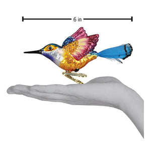 Vibrant hummingbird ornament with iridescent multicolored feathers and metallic finish perfect for figural decor or tree toppers