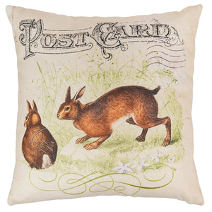 Beige vintage bunnies pillow with vintage postcard design and two brown rabbits on nicely woven fabric spreading holiday cheer