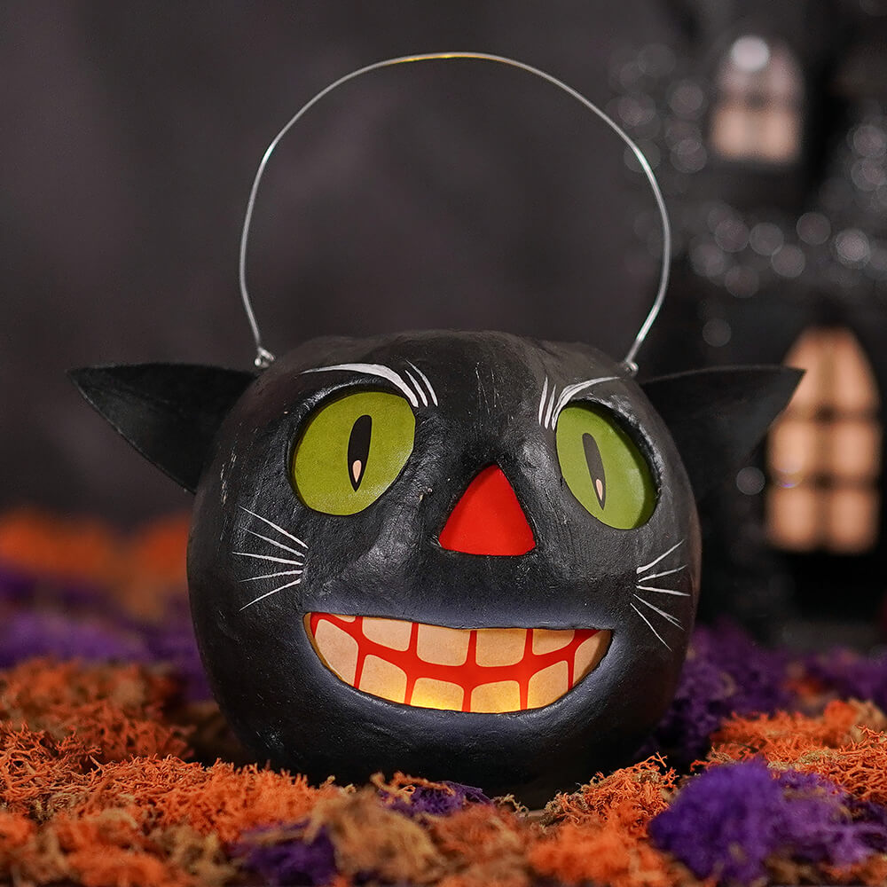 Vintage cat bucket small black halloween lantern with glowing green eyes red nose and orange smiling mouth by bethany lowe halloween buckets