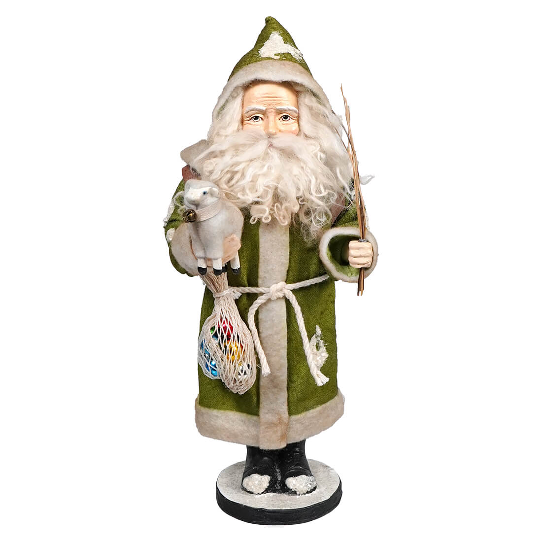 Traditional Santa Claus figurine wearing a green and white robe with decorative details.