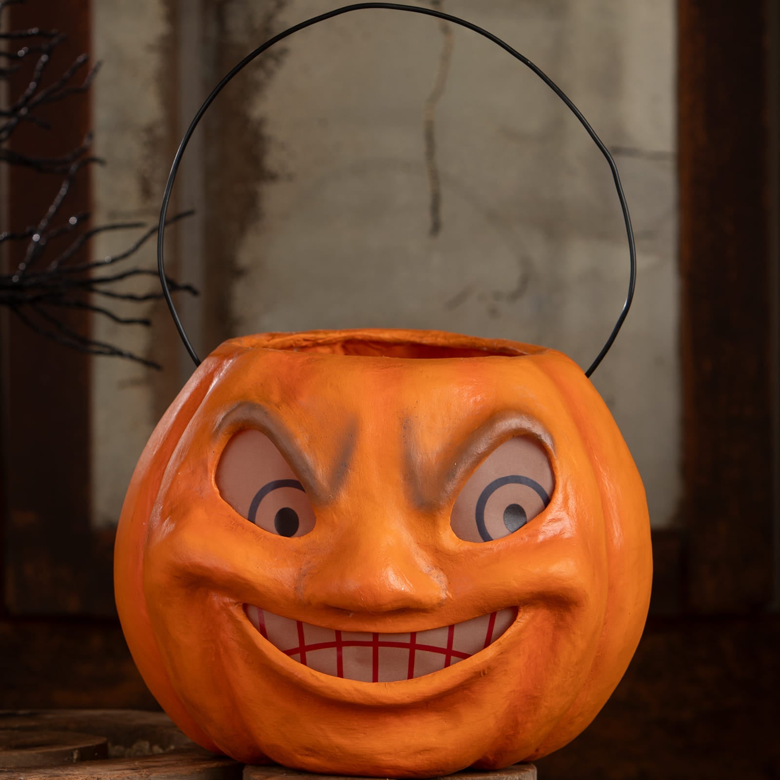 Vintage mad pumpkin bucket orange halloween bucket with black wire handle and cartoonish face for halloween pumpkins and gourds