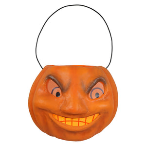 Vintage mad pumpkin bucket is an orange plastic halloween bucket with black wire handle and cartoonish face for candy