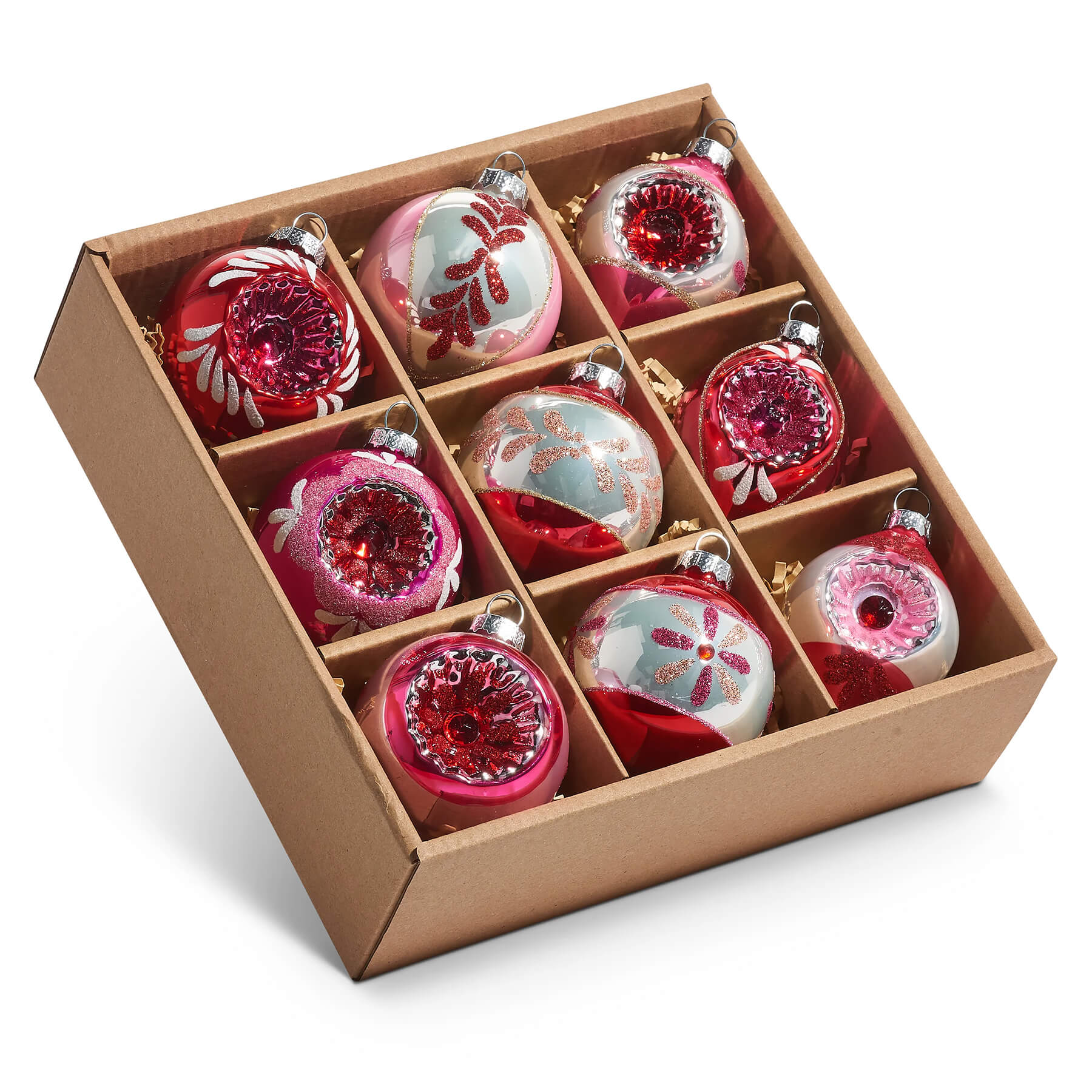 Set of nine vintage reflector and indent ornaments in red pink and silver glass with floral and swirling designs
