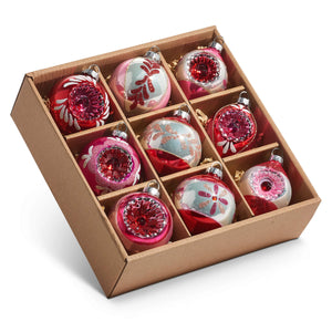 Set of nine vintage reflector and indent ornaments in red pink and silver glass with floral and swirling designs