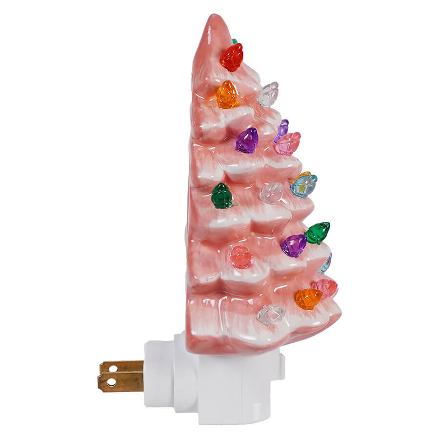 Pink Christmas tree-shaped night light with colorful gemstone decorations.