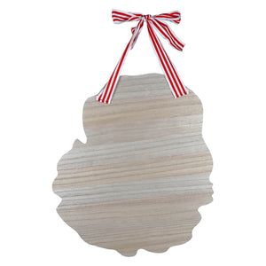 Vintage door hanger made of light wood with scalloped edges and a red and white striped bow for santa paper wall decor