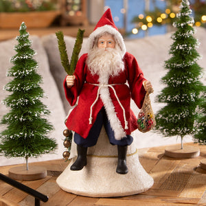 Vintage santa on bell figurine in red robe with white fur trim holding green branches and colorful ornaments, folk art santas