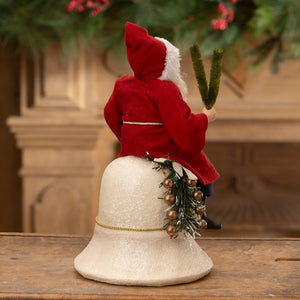 Vintage santa on bell figurine dressed in red velvet sitting on white textured bell with gold ornaments and greenery ideal for folk art santas collection