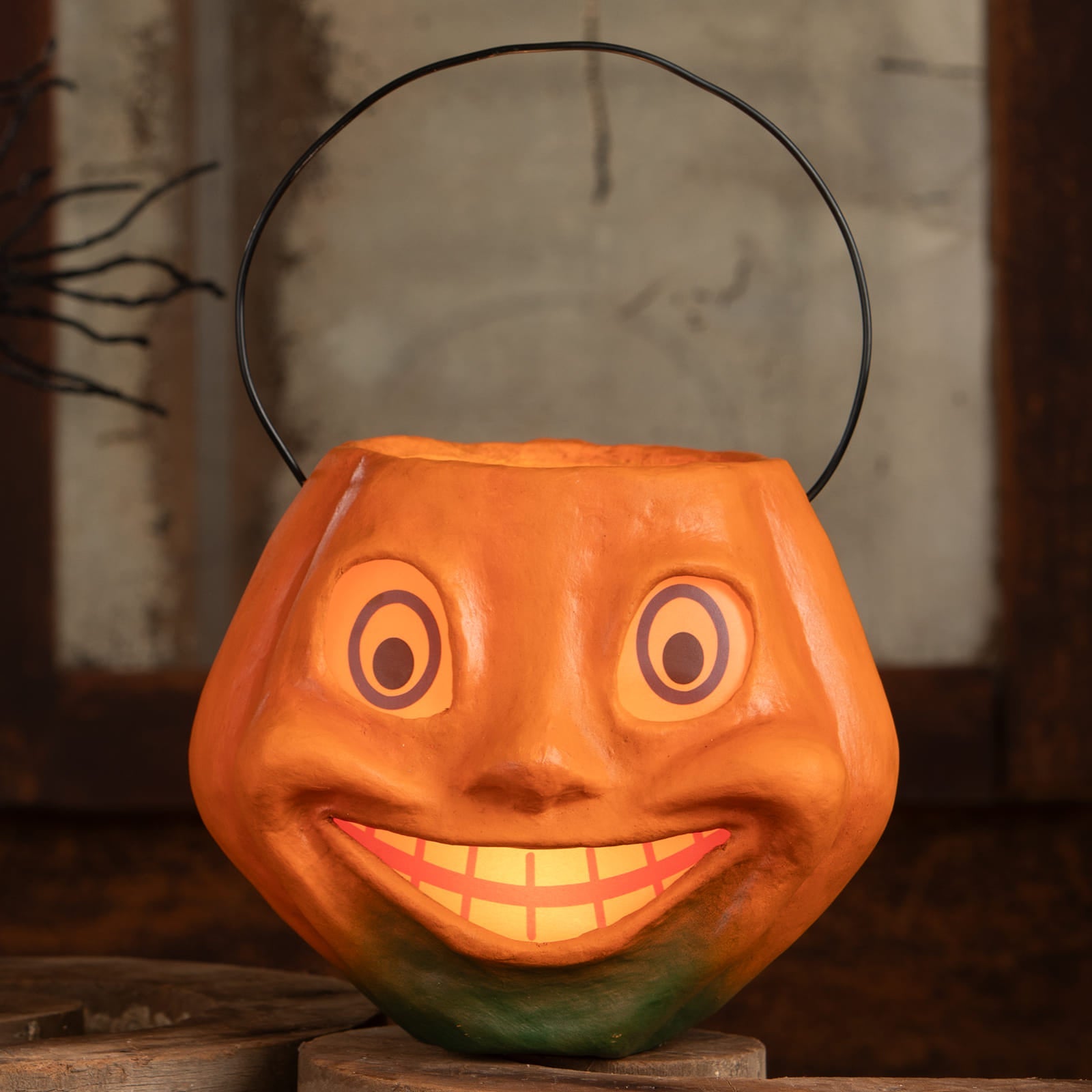 Vintage silly pumpkin bucket is an orange halloween pumpkins and gourds candy bucket with a smiling face and black handle