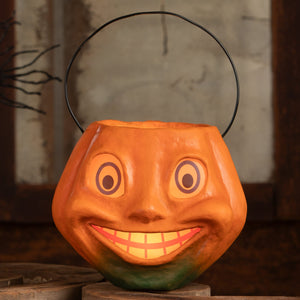Vintage silly pumpkin bucket is an orange halloween pumpkins and gourds candy bucket with a smiling face and black handle