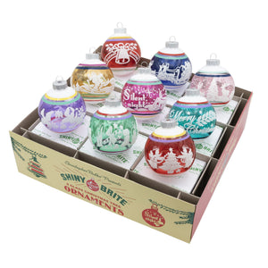 A set of 9 vivid vintage signature flocked round ornaments in colorful glass with festive designs and silver caps in a box
