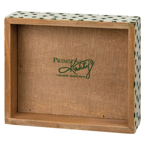 Wooden display box with a floral patterned border and ’Primitives by Kathy’ logo.
