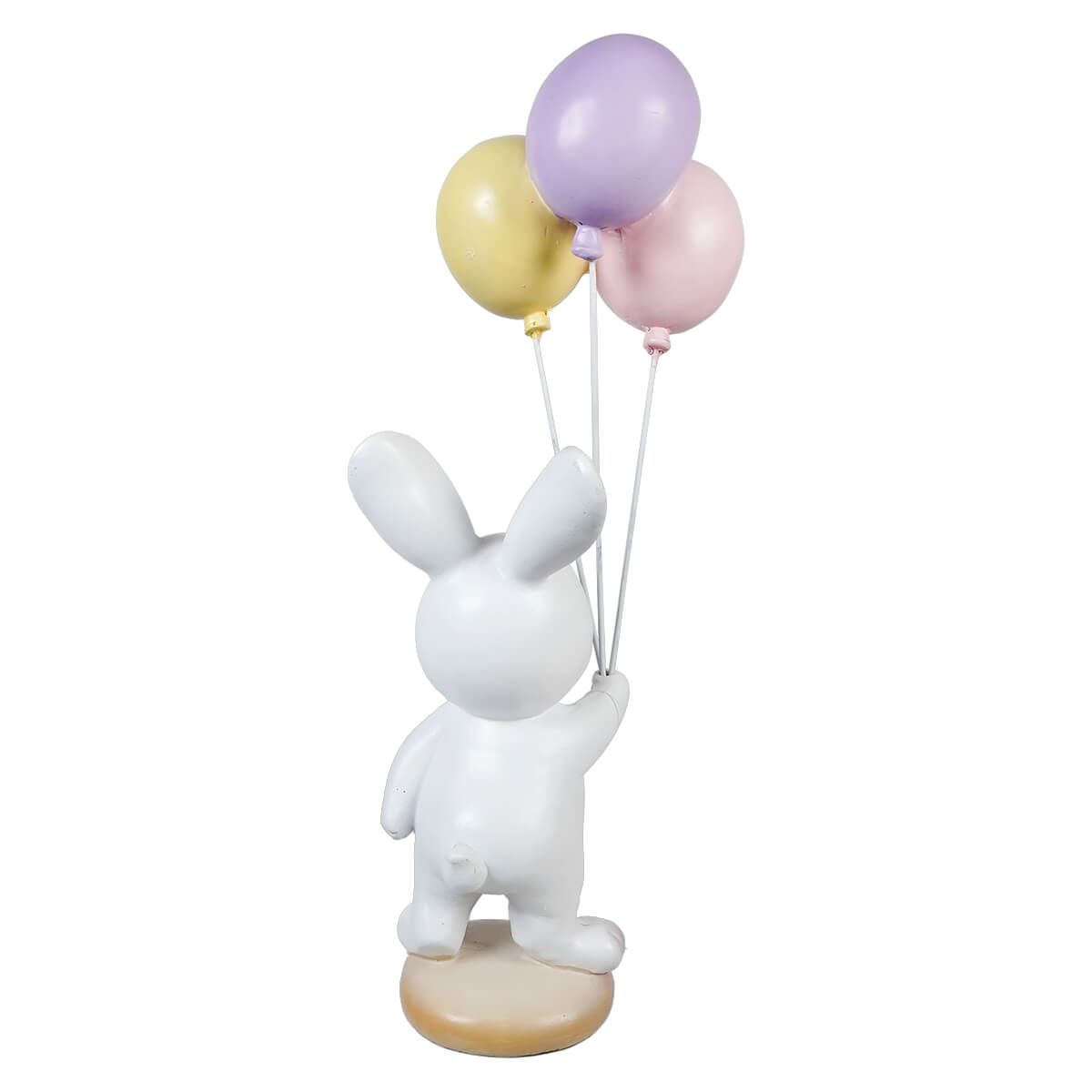 White bunny holding easter wishes balloons with three pastel-colored balloons on a white ceramic figurine