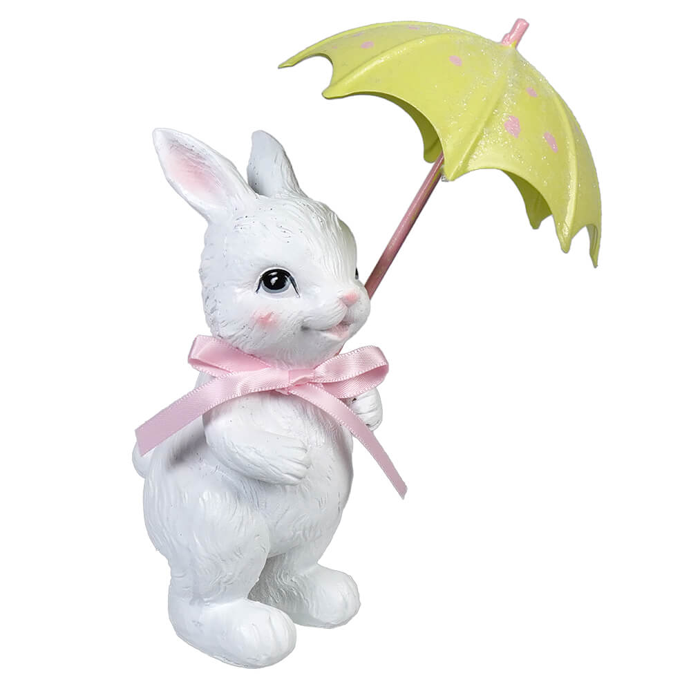 White bunny figurine with pink ribbon holding green umbrella and yellow umbrella vintage easter bunny figural decor