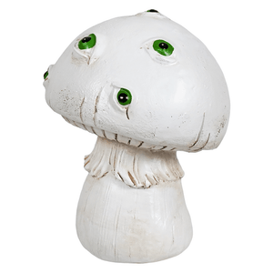White creepy mushroom figurine with three bright green eyes and a textured slightly weathered surface