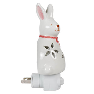 White ceramic easter bunny night light with flower cutouts pink ears and red collar for holiday lights and lighted decor