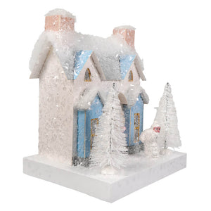 A charming cody foster white french villa christmas house with white glittery exterior and light blue window accents